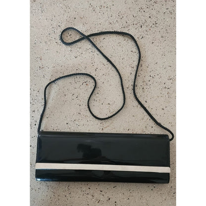 Clutch Purse - Pre-owned.  In great shape.  Shiny black with silver bar
