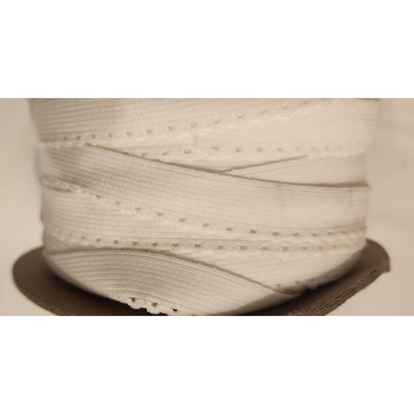 150 Yards (Spool) - stretch white 5/8" elastic - a little dusty from storage