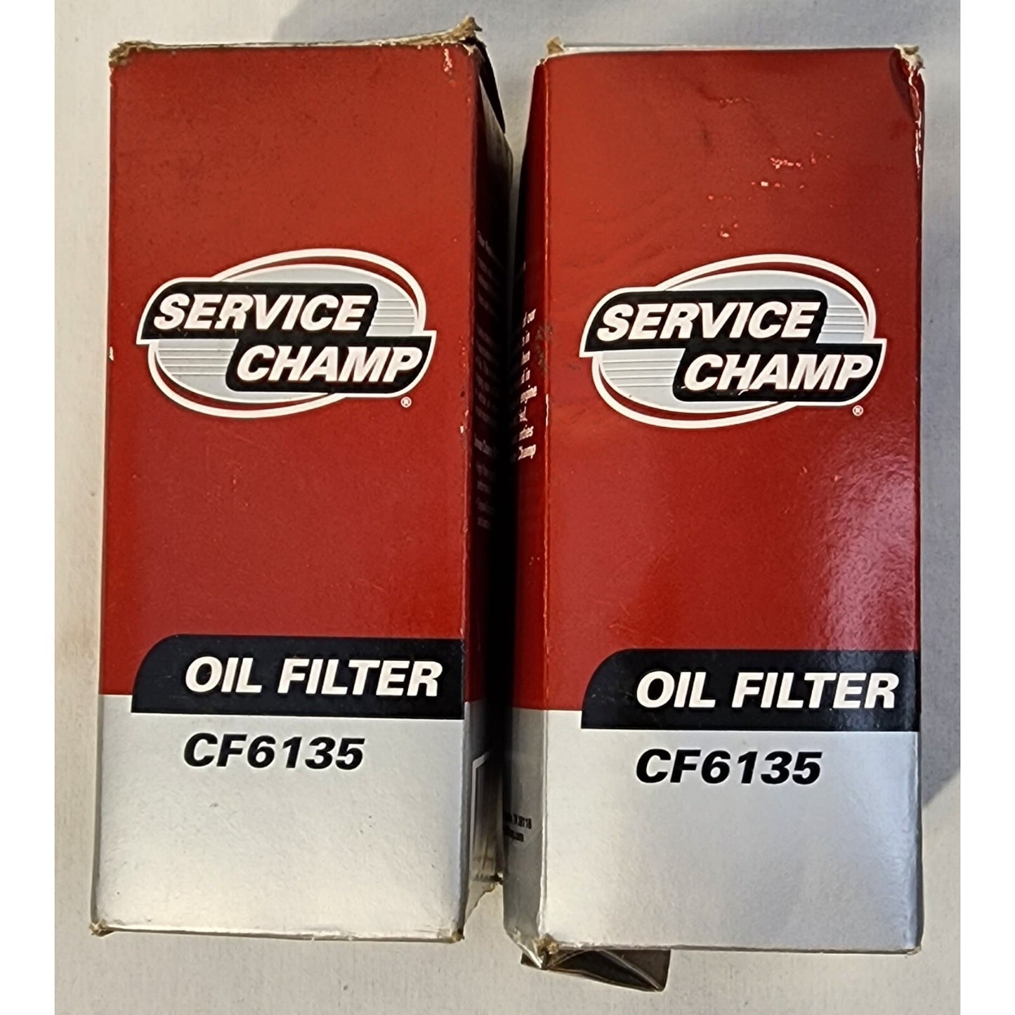 Two (2 - )Service Champ Oil Filters - CF6135 -Chrysler 2012-13, 3.6L engine. NEW